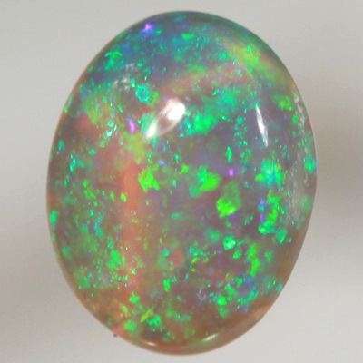 SOLID CRYSTAL OPAL Bright sparkles of greens throughout a purple hue
